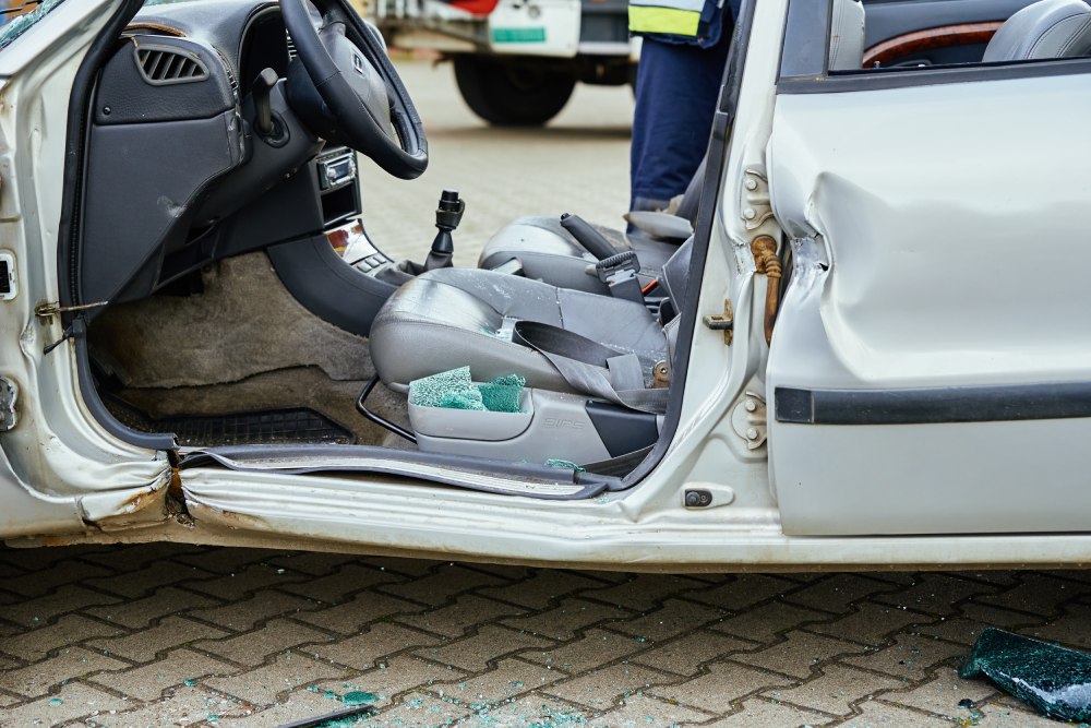 Damaged car on road after a truck accident