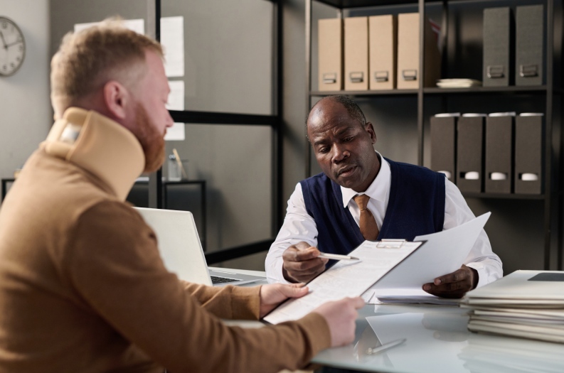 Man talking to lawyer after a truck accident